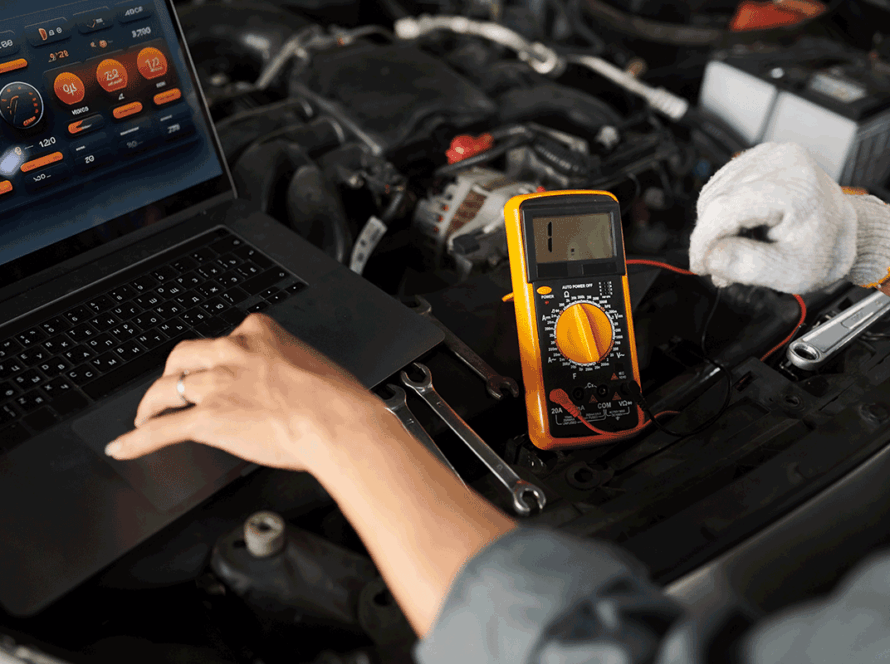 Mechanic using multimeter