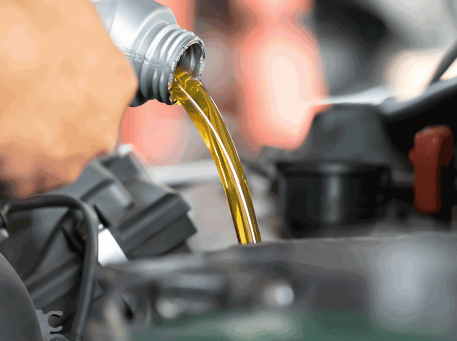 Pouring engine oil to car engine fresh oil poured